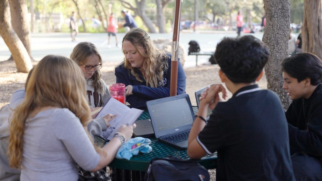 Teacher with students outside